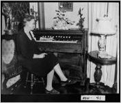 [Photograph of Mrs. Osborne Odum at her organ, Covington, Newton County, Georgia, 196-]