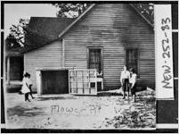 [Photograph of the Hopewell School House with children and a flower pit, Newton County, Georgia, 1923]