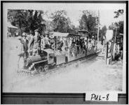 [Photograph of large-scale toy locomotive pulling cars with children, Hawkinsville, Pulaski County, Georgia, 1925]