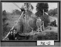 [Photograph of men rescuing automobile from ditch after accident, Pulaski County, Georgia, 1917]