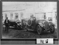 [Photograph of one automobile pulling another to Mobley's Garage and Machine Works, Hawkinsville, Pulaski County, Georgia, ca. 1917]