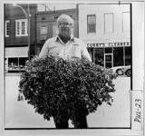 [Photograph of man with peanuts, Hawkinsville, Pulaski County, Georgia, ca. 1977]