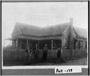 [Photograph of Mr. and Mrs. A. C. Dickens and others at home, Putnam County, Georgia, ca. 1915]
