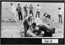 [Photograph of men starting a fire to make tar, Mountain City, Rabun County, Georgia, ca. 1970]