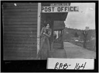 [Photograph of woman standing outside post office, Clayton, Rabun County, Georgia, ca. 1900]