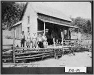 [Photograph of Sarah Trusty with her children in front of their home, Rabun County, Georgia, 1913]