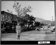 [Photograph of Lillian Eugenia Smith walking on Main Street, Clayton, Rabun County, Georgia, 1944]