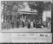 Doctor Benjamin E. Bridgman stands holding his horse and buggy and driver at the family reunion at Zebulon T. Phelps home. Pearl Street, Shellman, Ga.