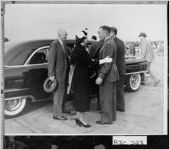 [Photograph of President and Mrs. Dwight D. Eisenhower with members of the crew of Air Force One at Bush Field, Augusta, Richmond County, Georgia, 1959 Apr. 21 ]