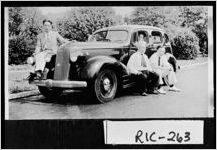 [Photograph of John Lam, Loo Fong, Loo Gihn Hong, and Sim Lee Jue, owners of a rolling grocery store, Augusta, Richmond County, Georgia, ca. 1935]