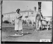 [Photograph of a couple playing golf, Sea Island, Glynn County, Georgia, ca. 1935]