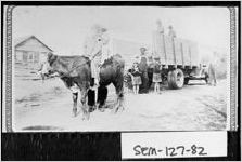 [Photograph of log house and first truck in Desser community, Seminole County, Georgia, 193-]