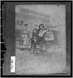 [Photograph of children in cart and man standing in uniform near cart, Thomas County, Georgia]