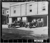 [Photograph of fire fighters and fire trucks in front of building, Thomas County, Georgia]