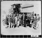 [Photograph of children in front of a bookmobile, Thomas County, Georgia]