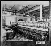 [Photograph of a worker beside machinery in a cotton mill, LaGrange, Troup County, Georgia, ca. 1930]