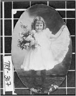 [Photograph of Eleanor Sledge Dunson, age 3, holding a bunch of roses, LaGrange, Troup County, Georgia, ca. 1899]