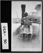 [Photograph of Jessie Reid holding Ellis Walton Sammons, United States, ca. 1940]