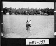 [Photograph of Elder J. W. Brantley baptizing woman in Augusta Lake, Washington County, Georgia, 1953]