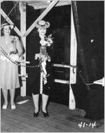 [Photograph of Mrs. J. Melville Broughton christening the Liberty ship Donald W. Bain, J.A. Jones Construction Company shipyard, Brunswick, Georgia, 1944 May 25?]