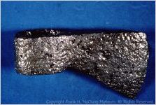 [Photograph of mid-18th century iron trade ax recovered at Chota] /  [by David Stansberry]