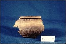 [Photograph of fragment of Cherokee vessel with check stamp design, Chota, taken in 1969] / [by George Fielder]