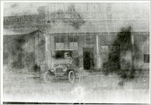 Block, Frank E. Co., delivery vehicle and driver, circa 1915