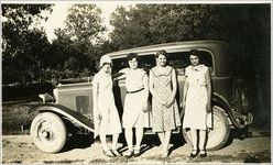 Group portrait : Blandina Jung on right with unidentified others, in front of auto, circa 1920s
