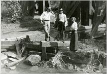 Group portrait : Jung, Alphonse and Corbin and Irene under railroad trestle near creek, circa 1912
