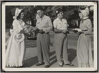 Photograph of two women and two men dressed as "old timers" during the Worth County Centennial Celebration at the Worth County Courthouse in Sylvester, Worth County, Georgia, 1953 October