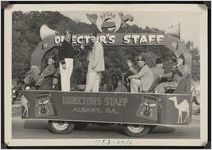 Photograph of Brown Wilden and other Shriners riding the "HASAN Director's Staff" float in a Worth County Centennial Celebration parade in Sylvester, Worth County, Georgia, 1953 October