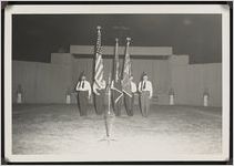 Photograph of Frank Thornhill and other unidentified men carrying flags during the Worth County Centennial Celebration at the Sylvester High School stadium in Sylvester, Worth County, Georgia, 1953 October
