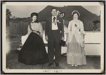 Photograph of Betty Jean Carter, Governor Herman Talmadge, and Evelyn Burkett in costume on Georgia Day during the Worth County Centennial Celebration in Sylvester, Worth County, Georgia, 1953 October