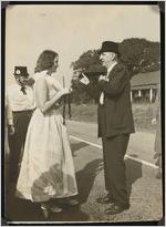 Photograph of Alice Wingate with an "old timers" tie and Senator Richard B. Russell on Agriculture Day during the Worth County Centennial Celebration in Sylvester, Worth County, Georgia, 1953 October
