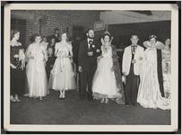 Photograph of a group of men and women with Miss Centennial and the Queen of Worth County taken during the Worth County Centennial Celebration in Sylvester, Worth County, Georgia, 1953 October