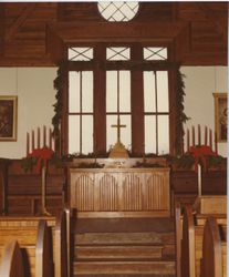 Photograph of the inside of Barnwell Chapel with the altar and windows decorated for Christmas, Mount Berry, Georgia, 19XX