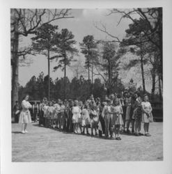 Photograph of Possum Trot children with teacher standing in line, Mount Berry, Georgia, 195X