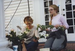 Photograph of students arranging flowers for a scene in the movie “Sweet Home Alabama,” Mount Berry, Georgia, 2001 November