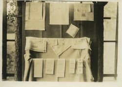 Photograph of a display of woven towels and napkins in the Ford Weaving Room, Mount Berry, Georgia, 19XX
