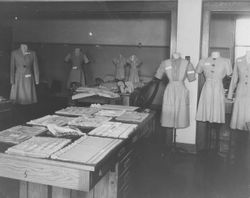 Photograph of a display of sewn and woven goods in the Ford Weaving Room, Mount Berry, Georgia, 19XX