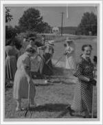 Photograph of a group of women cleaning the cemetery, Manchester, Georgia, 1953