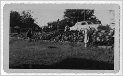 Photograph of a woman working in her yard, Manchester, Georgia, 1953
