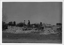 Photograph of men cleaning up a rubble stewn area, Manchester, Georgia, 1953