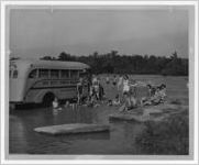 Photograph of children from Bar Rest Ranch playing in the water at Flat Shoals on the Flint River, Warm Springs, Georgia, 1953