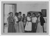 Photograph of African American students gathered around a Coca Cola machine, Manchester, Georgia, 1953