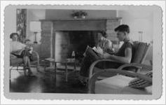 Photograph of people sitting before the fireplace in the golf clubhouse, Warm Springs, Georgia, 1953