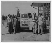 Photograph of men standing in front of a Fryer Motor Company truck, Manchester, Georgia, 1953
