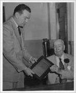 Photograph of Dr. T. W. Jackon receiving a plaque from Claude Bray, Manchester, Georgia, 1953