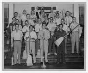 Photograph of the Lions Club holding brooms, Manchester, Georgia, 1953