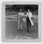Photograph of the Northside Baptist Church pastor studying church blueprints, Manchester, Georgia, 1953